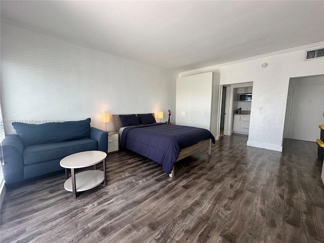 700 Biltmore Way Unit 1216, Coral Gables, FL 33134 - bedroom featuring dark wood-type flooring and crown molding
