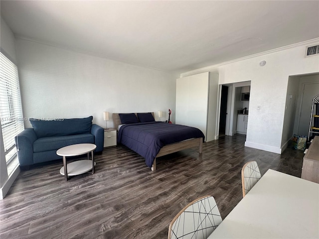 700 Biltmore Way Unit 1216, Coral Gables, FL 33134 - bedroom with ornamental molding and dark wood finished floors