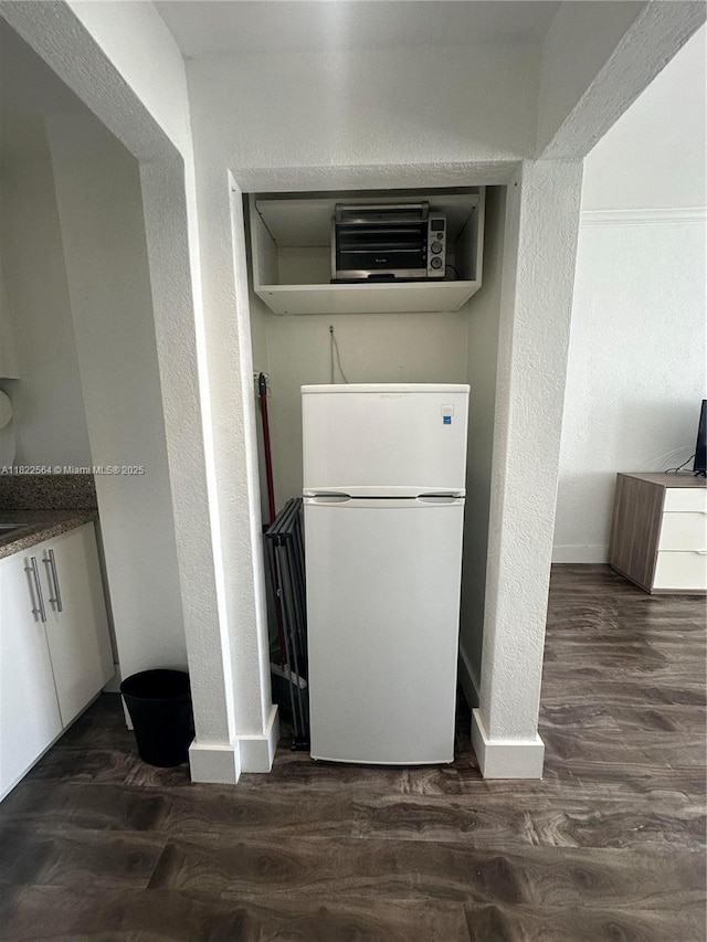 700 Biltmore Way Unit 1216, Coral Gables, FL 33134 - kitchen with freestanding refrigerator, dark wood-type flooring, and a textured wall