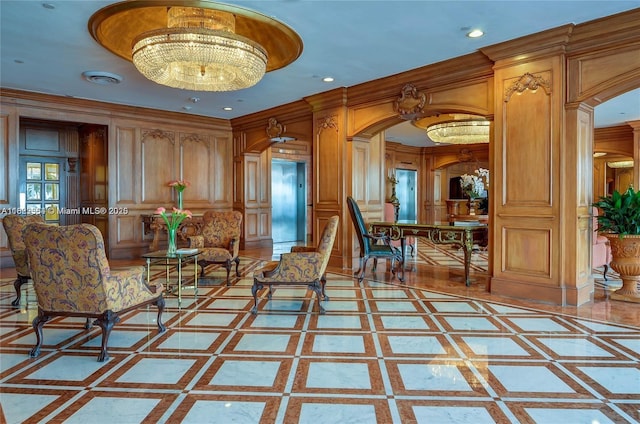 700 Biltmore Way Unit 1216, Coral Gables, FL 33134 - living area featuring inlaid floor details, arched walkways, ornamental molding, a decorative wall, and a chandelier