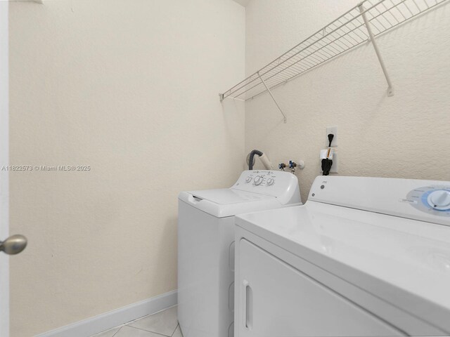 2590 SE 14th St, Homestead, FL 33035 - washroom featuring independent washer and dryer and light tile patterned flooring