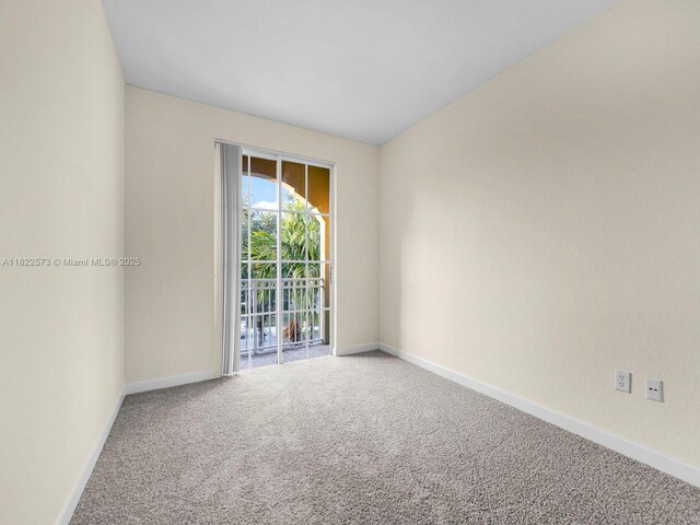 2590 SE 14th St, Homestead, FL 33035 - carpeted empty room featuring baseboards