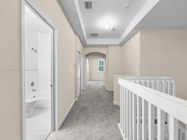 2590 SE 14th St, Homestead, FL 33035 - corridor featuring arched walkways, carpet, and a raised ceiling