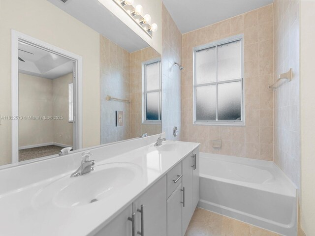 2590 SE 14th St, Homestead, FL 33035 - bathroom featuring double vanity, tile patterned flooring, and shower / washtub combination