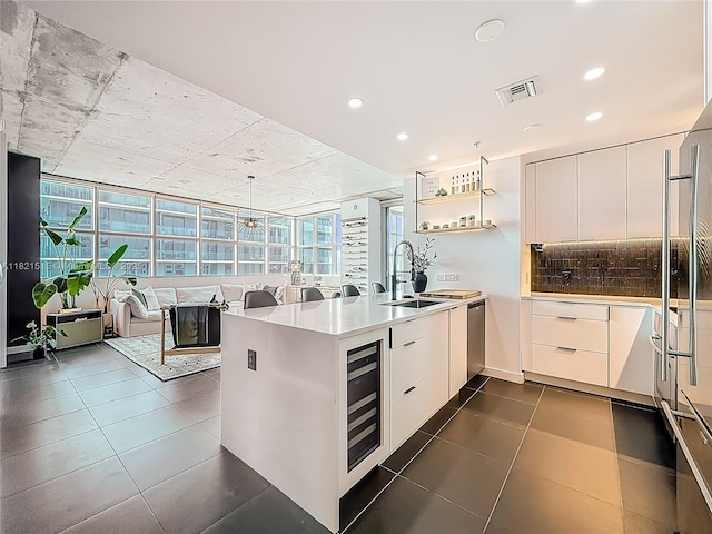 3301 NE 1st Ave Unit H1215, Miami, FL 33137 - kitchen with a peninsula, wine cooler, white cabinetry, modern cabinets, and recessed lighting