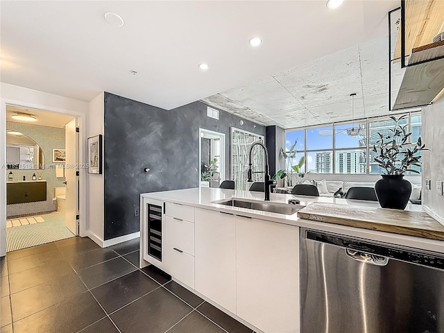 3301 NE 1st Ave Unit H1215, Miami, FL 33137 - kitchen featuring dishwasher, beverage cooler, white cabinetry, recessed lighting, and light countertops