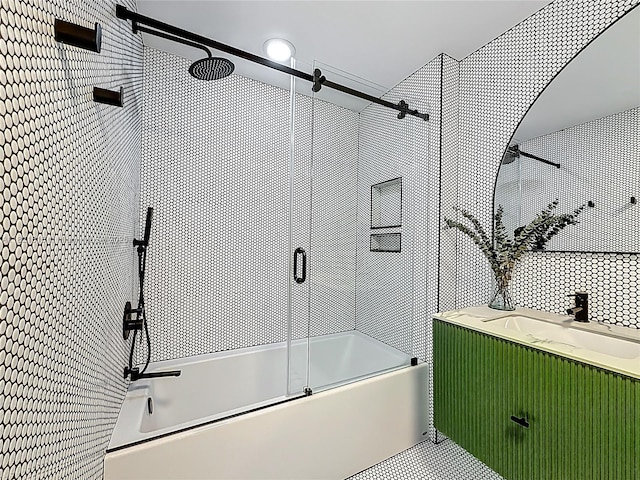 3301 NE 1st Ave Unit H1215, Miami, FL 33137 - bathroom featuring combined bath / shower with glass door, vanity, and tile walls