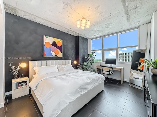 3301 NE 1st Ave Unit H1215, Miami, FL 33137 - bedroom featuring an accent wall, dark tile patterned flooring, and a desk