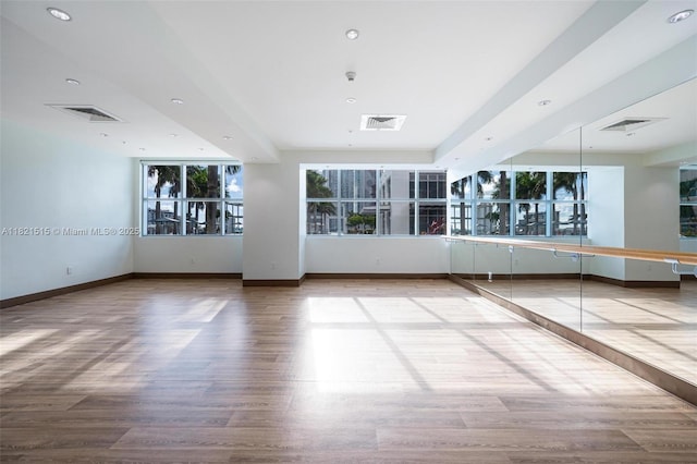 3301 NE 1st Ave Unit H1215, Miami, FL 33137 - unfurnished room with wood finished floors, healthy amount of natural light, and recessed lighting