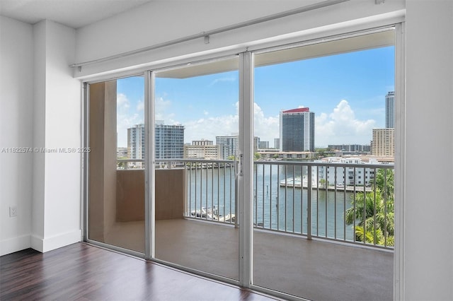 1965 S Ocean Dr Unit 6Q, Hallandale Beach, FL 33009 - doorway featuring a water view, wood finished floors, and a city view