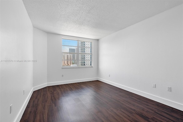 1965 S Ocean Dr Unit 6Q, Hallandale Beach, FL 33009 - spare room with dark wood finished floors and a textured ceiling