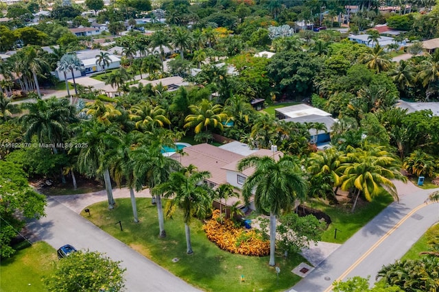 aerial perspective of suburban area featuring a tree filled landscape