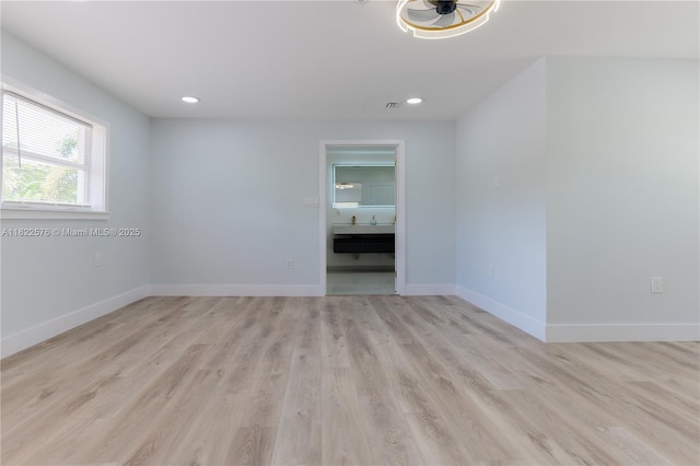 unfurnished room with light wood-style floors and recessed lighting