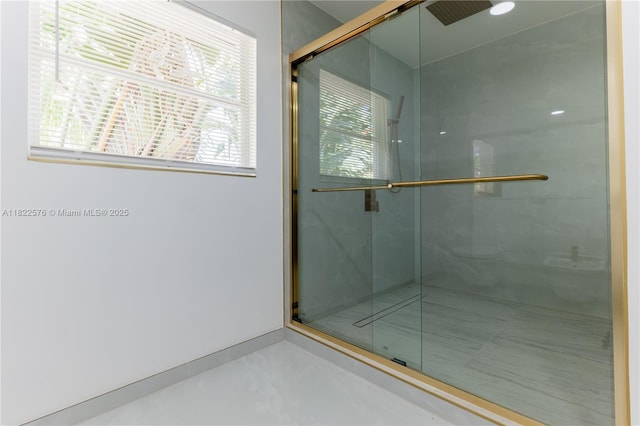 full bath featuring healthy amount of natural light and a shower stall