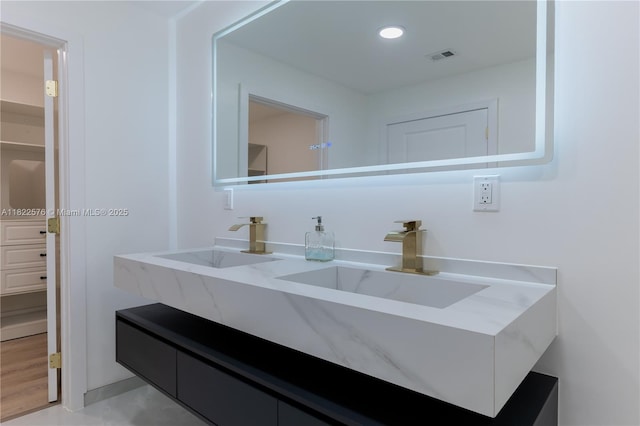 bathroom featuring vanity and recessed lighting