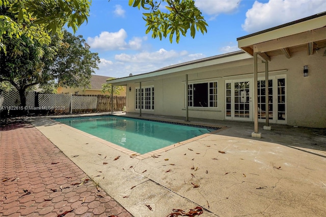 7220 NW 44th Ct, Lauderhill, FL 33319 - view of swimming pool with a patio area and french doors