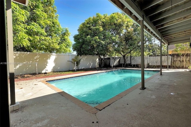7220 NW 44th Ct, Lauderhill, FL 33319 - view of swimming pool with a fenced backyard and a patio