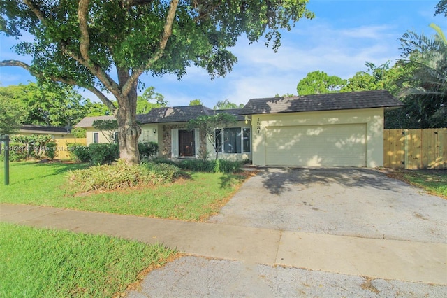 1531 SW 67th Ter, Plantation, FL 33317 - ranch-style home with an attached garage, driveway, and stucco siding
