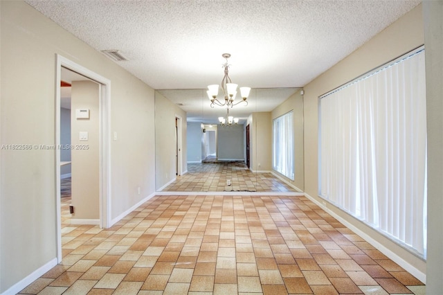 1531 SW 67th Ter, Plantation, FL 33317 - hallway featuring a chandelier and a textured ceiling