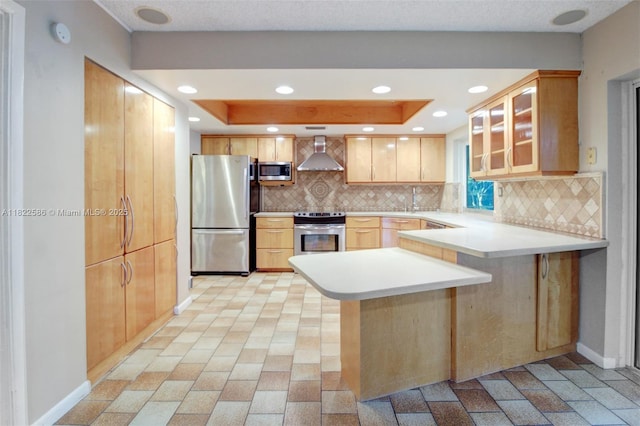 1531 SW 67th Ter, Plantation, FL 33317 - kitchen featuring stainless steel appliances, wall chimney range hood, a peninsula, tasteful backsplash, and glass insert cabinets