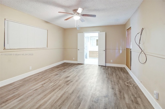 1531 SW 67th Ter, Plantation, FL 33317 - empty room with wood finished floors, a textured ceiling, and ceiling fan