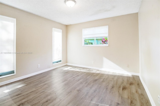 1531 SW 67th Ter, Plantation, FL 33317 - empty room featuring wood finished floors and a textured ceiling