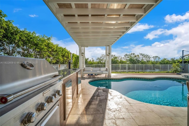 942 Lavender Cir, Weston, FL 33327 - view of pool featuring a fenced backyard, a patio area, and exterior kitchen