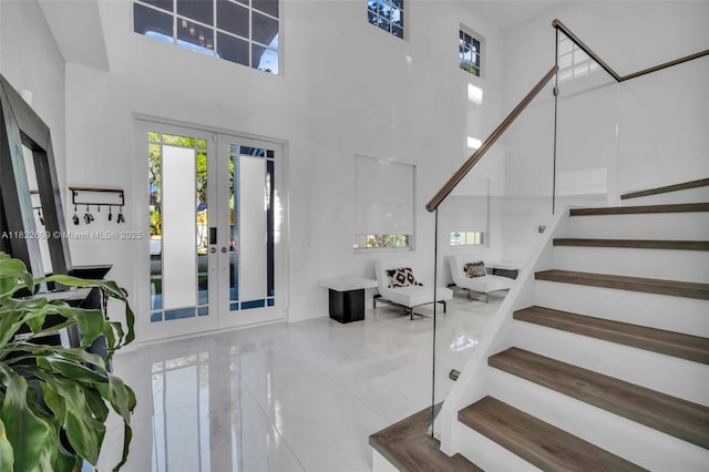 942 Lavender Cir, Weston, FL 33327 - tiled entryway featuring french doors, a high ceiling, and stairs