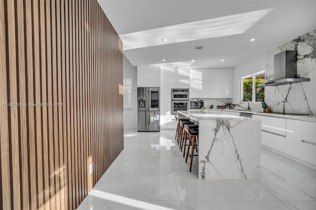 942 Lavender Cir, Weston, FL 33327 - kitchen featuring modern cabinets, appliances with stainless steel finishes, island range hood, white cabinets, and recessed lighting