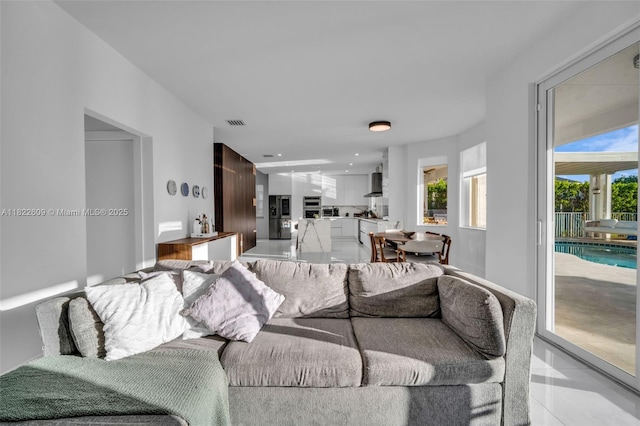 942 Lavender Cir, Weston, FL 33327 - living room featuring light tile patterned floors and recessed lighting