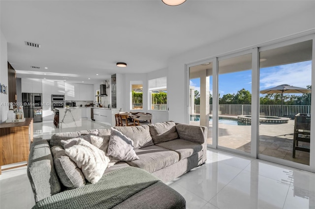 942 Lavender Cir, Weston, FL 33327 - living area featuring light tile patterned floors and recessed lighting