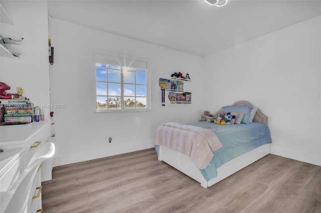 942 Lavender Cir, Weston, FL 33327 - bedroom featuring light wood finished floors and baseboards