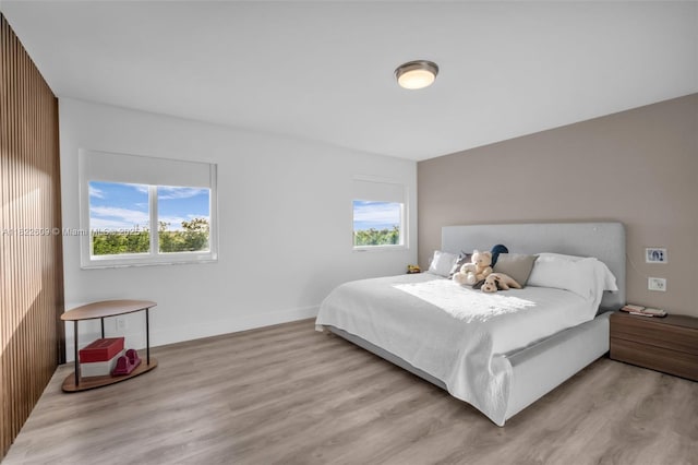 942 Lavender Cir, Weston, FL 33327 - bedroom featuring light wood-style flooring and multiple windows