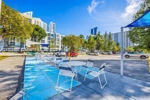17570 Atlantic Blvd Unit 119, Sunny Isles Beach, FL 33160 - view of pool with a view of city and shuffleboard