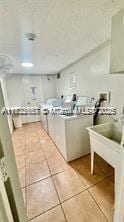 17570 Atlantic Blvd Unit 119, Sunny Isles Beach, FL 33160 - kitchen featuring tile patterned flooring and tile countertops