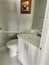 17570 Atlantic Blvd Unit 119, Sunny Isles Beach, FL 33160 - bathroom featuring vanity and toilet