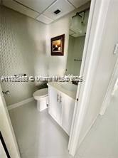 17570 Atlantic Blvd Unit 119, Sunny Isles Beach, FL 33160 - bathroom featuring vanity and a drop ceiling