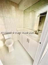 17570 Atlantic Blvd Unit 119, Sunny Isles Beach, FL 33160 - bathroom with vanity and toilet