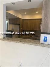 17570 Atlantic Blvd Unit 119, Sunny Isles Beach, FL 33160 - kitchen with recessed lighting and light stone counters
