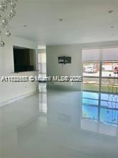 17570 Atlantic Blvd Unit 119, Sunny Isles Beach, FL 33160 - unfurnished living room with tile patterned floors
