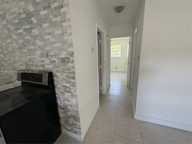 9801 SW 56th St, Miami, FL 33165 - hall featuring washer / dryer, light tile patterned floors, and attic access