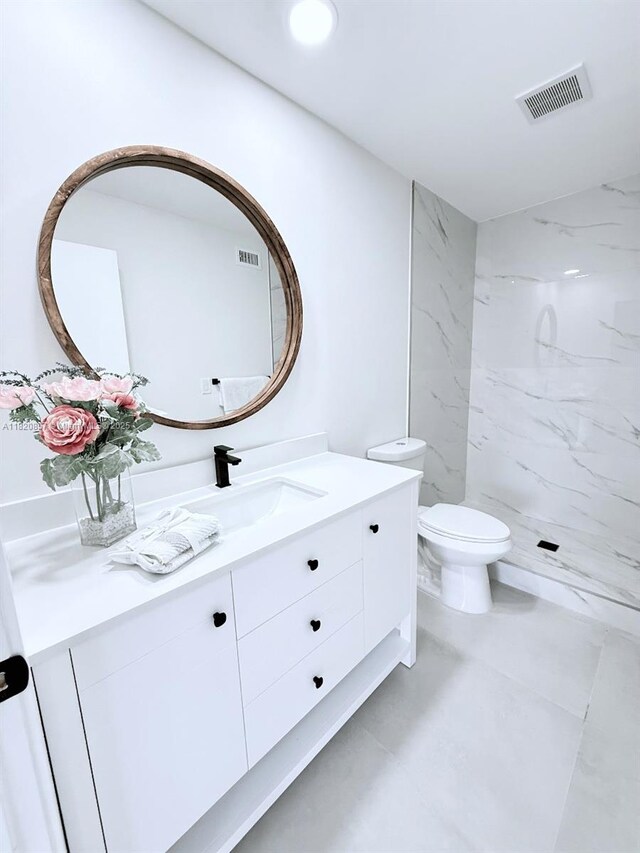 316 Cape Cod Cir Unit B, Lake Worth, FL 33467 - bathroom featuring a marble finish shower and vanity