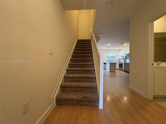 10586 W 33rd Ct Unit 10586, Hialeah, FL 33018 - stairs with wood finished floors and recessed lighting