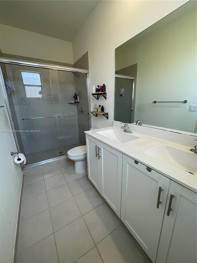 10586 W 33rd Ct Unit 10586, Hialeah, FL 33018 - bathroom with tile patterned flooring, double vanity, and a shower stall