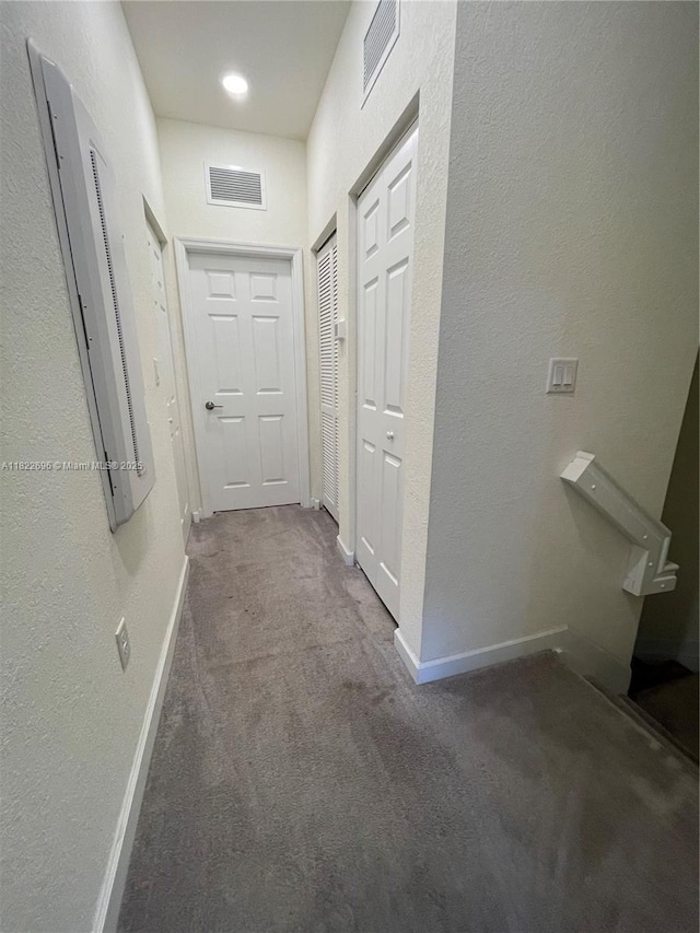 10586 W 33rd Ct Unit 10586, Hialeah, FL 33018 - hallway featuring carpet and a textured wall