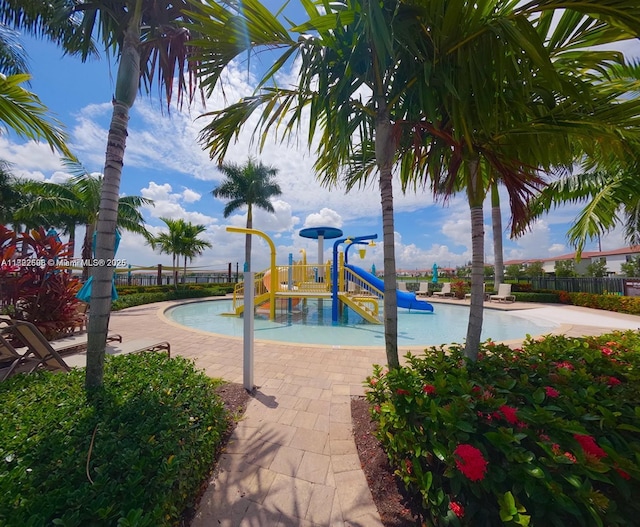 10586 W 33rd Ct Unit 10586, Hialeah, FL 33018 - community play area featuring a water play area and a community pool