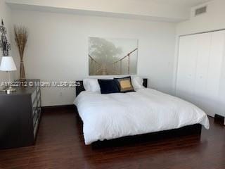 90 SW 3rd St Unit 3010, Miami, FL 33130 - bedroom with dark wood-style flooring and a closet