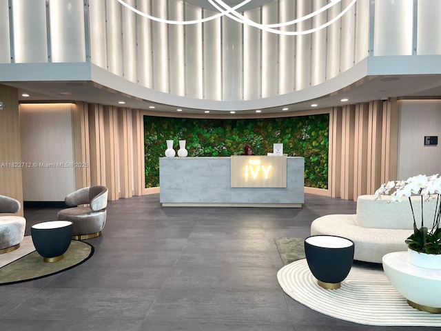 90 SW 3rd St Unit 3010, Miami, FL 33130 - reception area with wallpapered walls, a towering ceiling, and recessed lighting