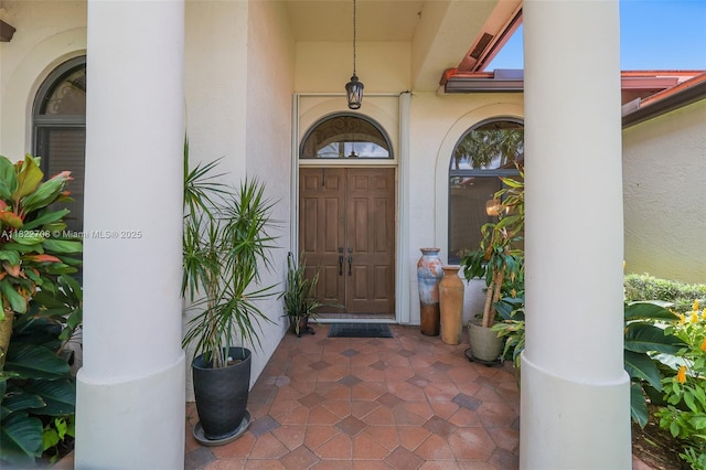 2489 Eagle Watch Ln, Weston, FL 33327 - property entrance featuring stucco siding and a porch