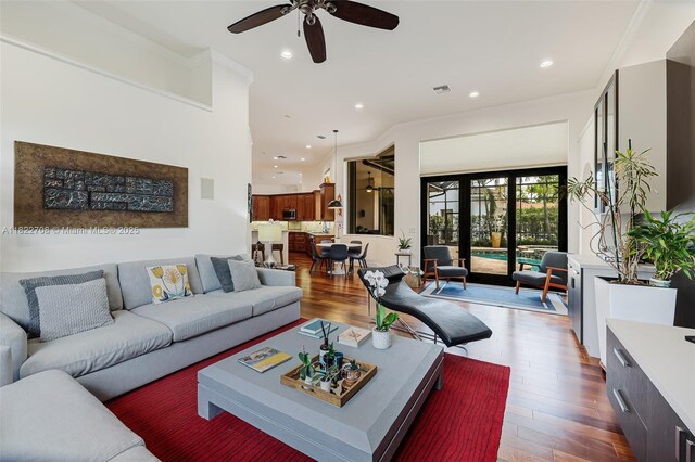 2489 Eagle Watch Ln, Weston, FL 33327 - living area with wood finished floors, ceiling fan, and recessed lighting